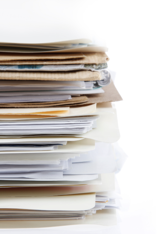 Pile of documents - E-Verify Records Disposal